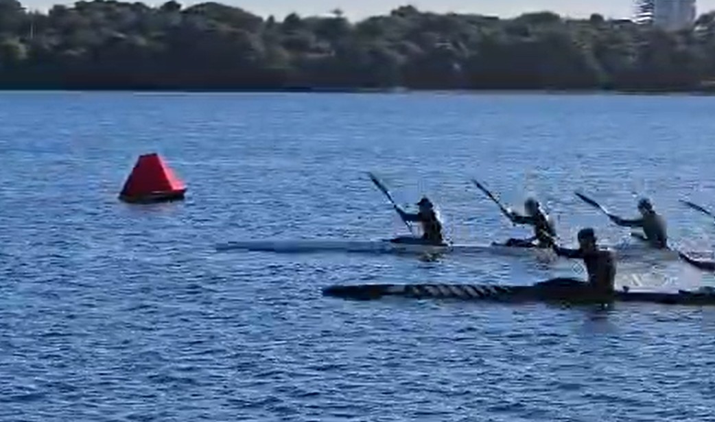 Kayak sprint passing a Sentenal